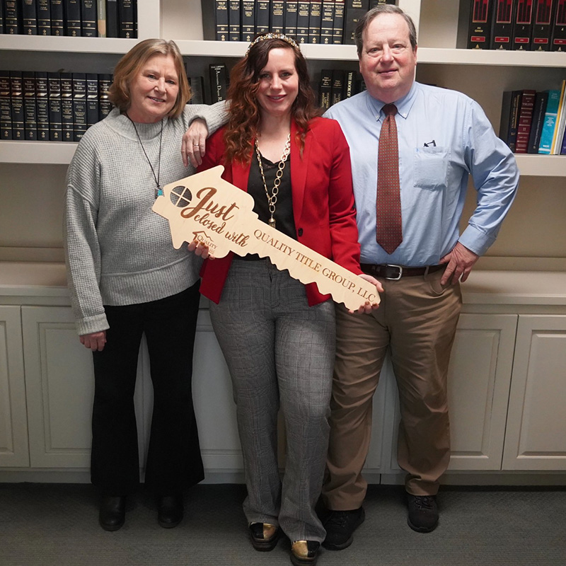 Team Members Holding Prop Key